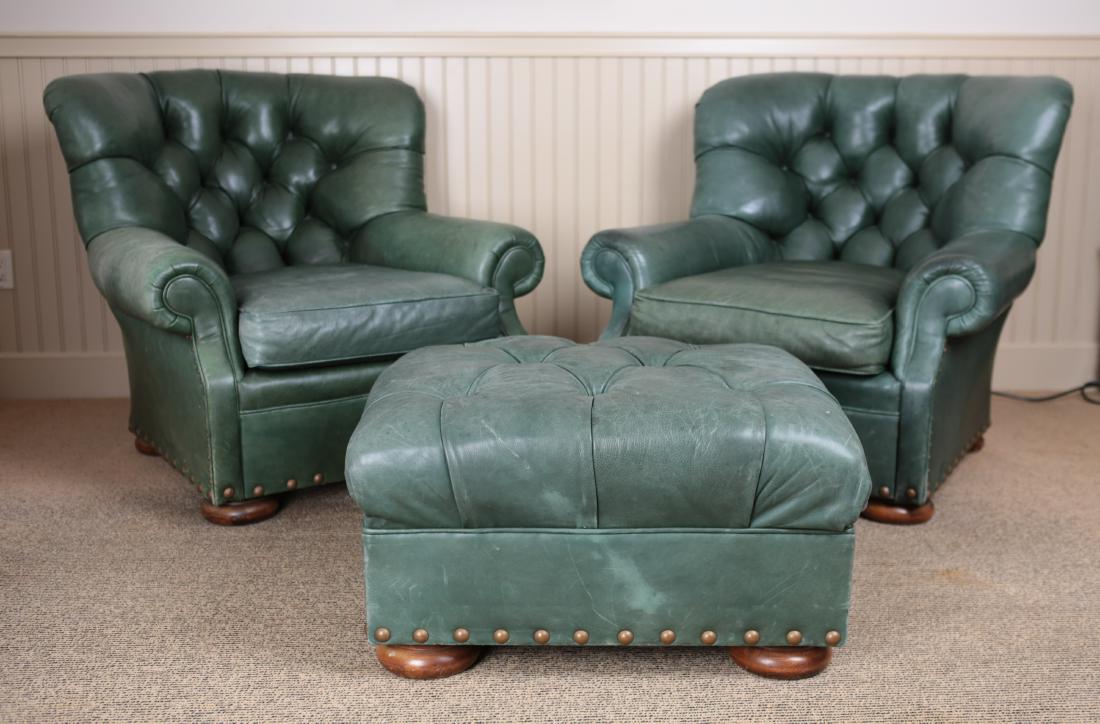 BUTTON TUFTED BRASS TACKED LEATHER LOUNGE CHAIRS: Tagged underneath one: Sam Moore Furniture. Dimensions: (Chair) H 37” x W 39” x D 39” x SH 18” Condition: Missing some brass tacks, few scuffs and white marks to leather. Some stains to leathe