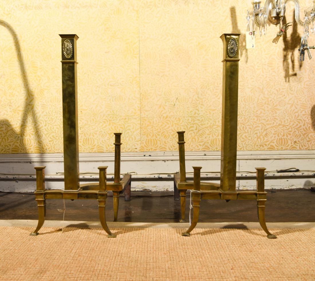 PAIR OF 1930S DECO STYLE ANDIRONS: Dimensions: H 23" x W 11" x D 19" Condition: Loose ornament on one, breaks to top, seams are coming apart. Both have loose connections.