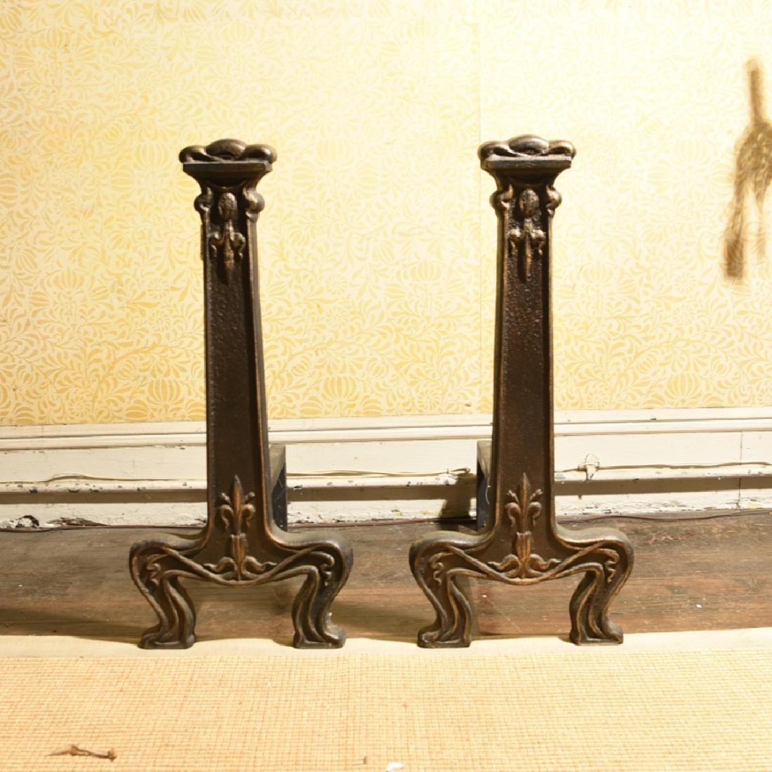 PAIR OF ARTS AND CRAFTS ANDIRONS: With gold spray details. Dimensions: H 24.75" x W 11" x D 21" Condition: Clean, no issues to note.