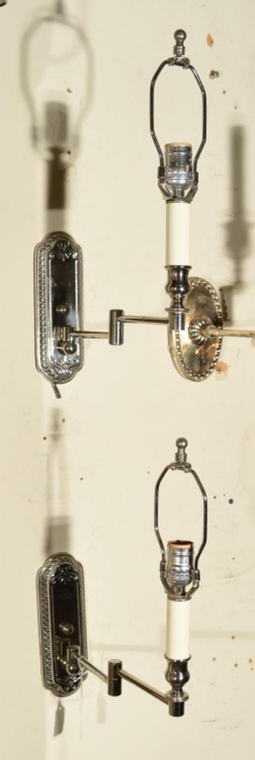 PAIR OF VINTAGE SWING ARM NICKEL PLATED SCONCES: Dimensions: H 16" x W 3" x D 12" Condition: A few small dings to the arms.