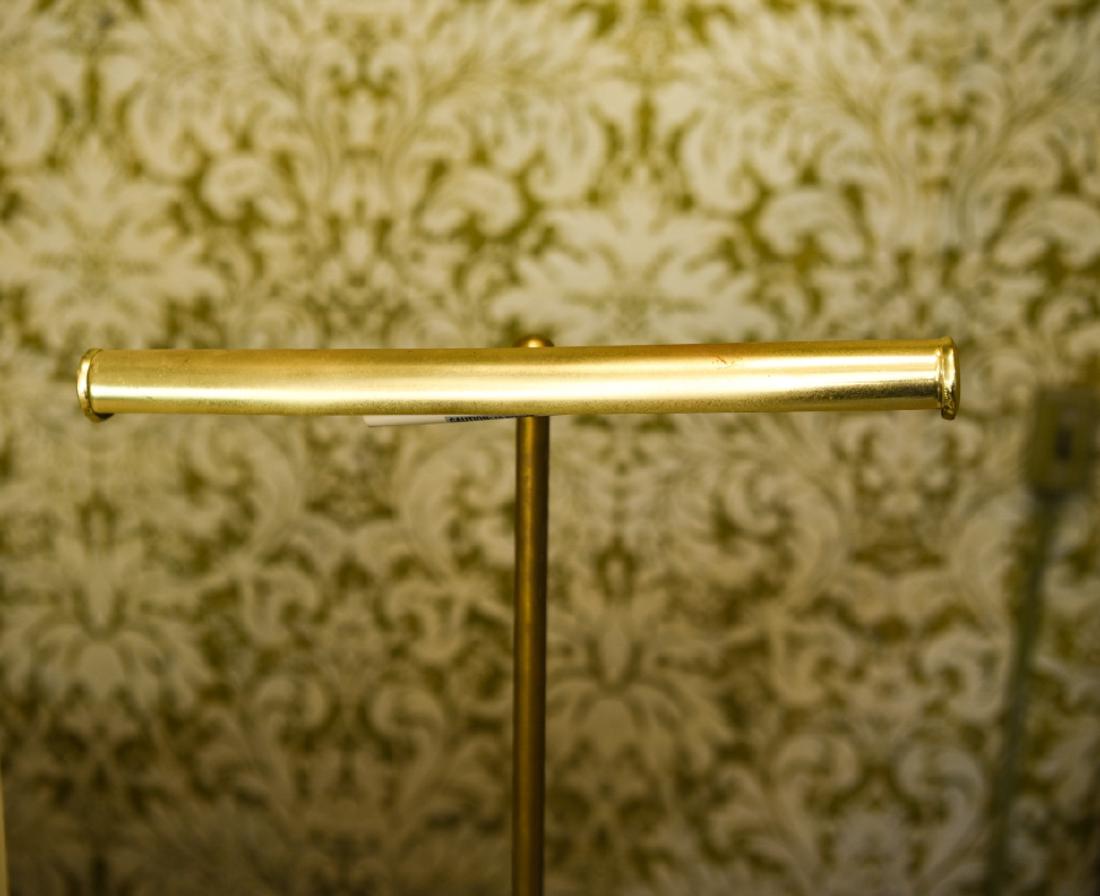 BRASS TONED PIANO STYLE LAMP: Dimensions: H 3" x W 14.75" x D 19.75" Condition: Scuffs, scratches, and rubs to surface finish.