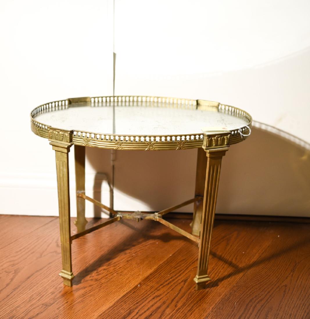 ANTIQUE BRASS & MIRRORED GLASS SIDE TABLE: Dimensions: H 17.75" x W 24" x D 17.25" Condition: Some de-silvering to mirror. Surface tarnish to brass. Mirror has rough cut edges.