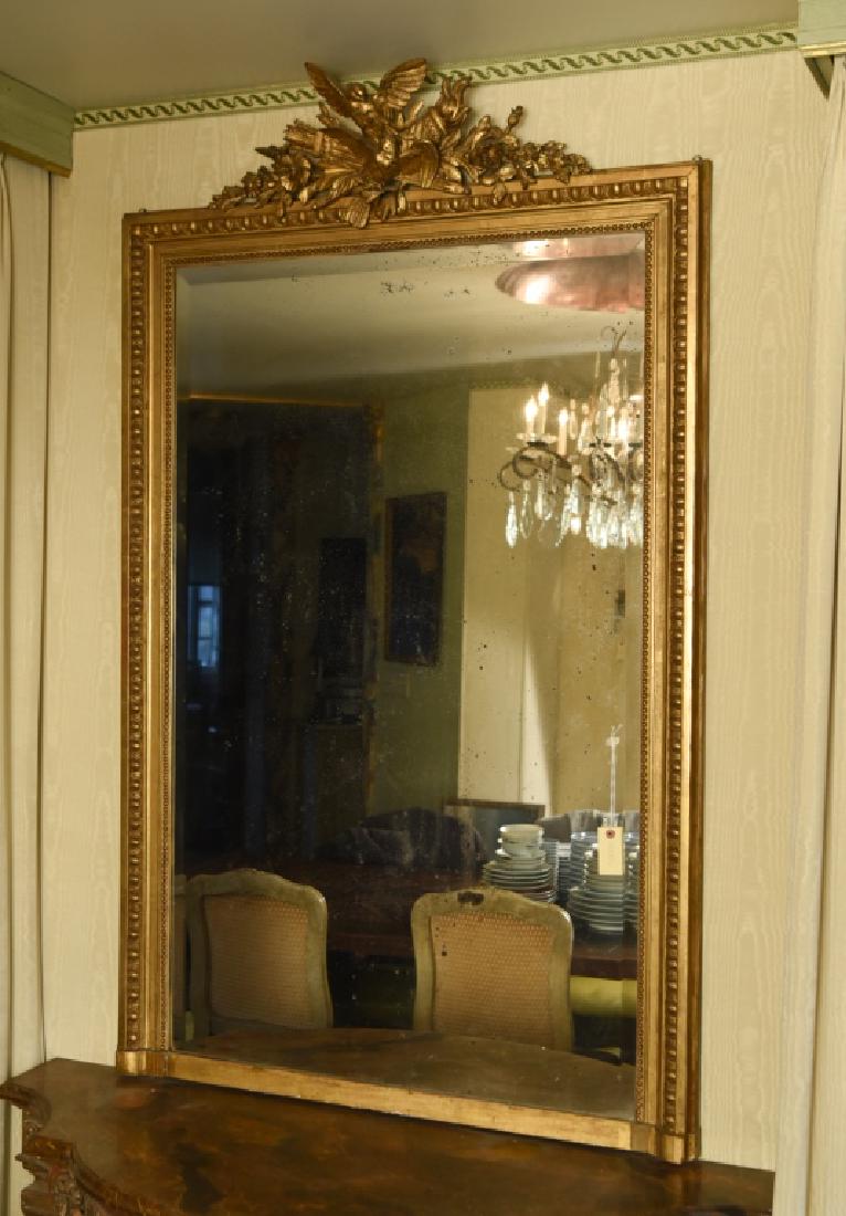 ANTIQUE GILT & CARVED WOOD PIER MIRROR: Dimensions: H 63" x W 38.5" Condition: Some areas of de-silvering to mirror. Minor loss to bottom trim.