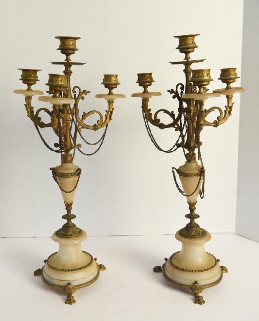 PAIR OF BRONZE & ONYX MARBLE CANDELABRAS: Dimensions: H 18.5" x Dia. 9" Condition: Some tarnishing to gilt bronze. Light bend to one candelabra arm. Some flea bites to edges of marble. One ornamental ring loose.