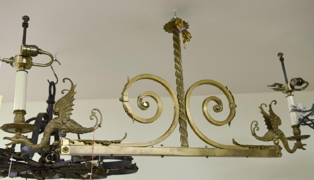 ANTIQUE BRASS DRAGON LIGHT FIXTURE CHANDELIER: Dimensions: H 21"x W 45.5" x D 4" Condition: Some surface tarnish.