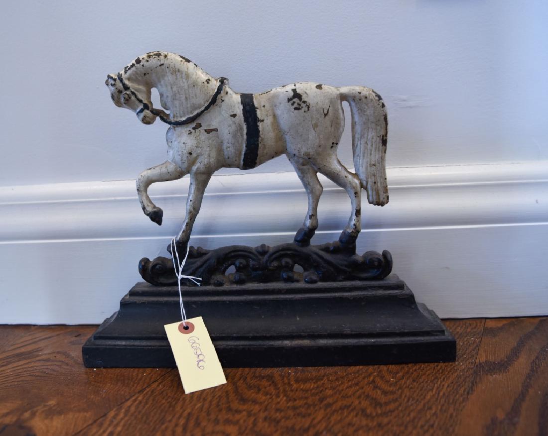 ANTIQUE CAST IRON PAINTED HORSE DOORSTOP: Dimensions: H 11" x W 13" x D 2.5" Condition: Painted finish wear consistent with age.