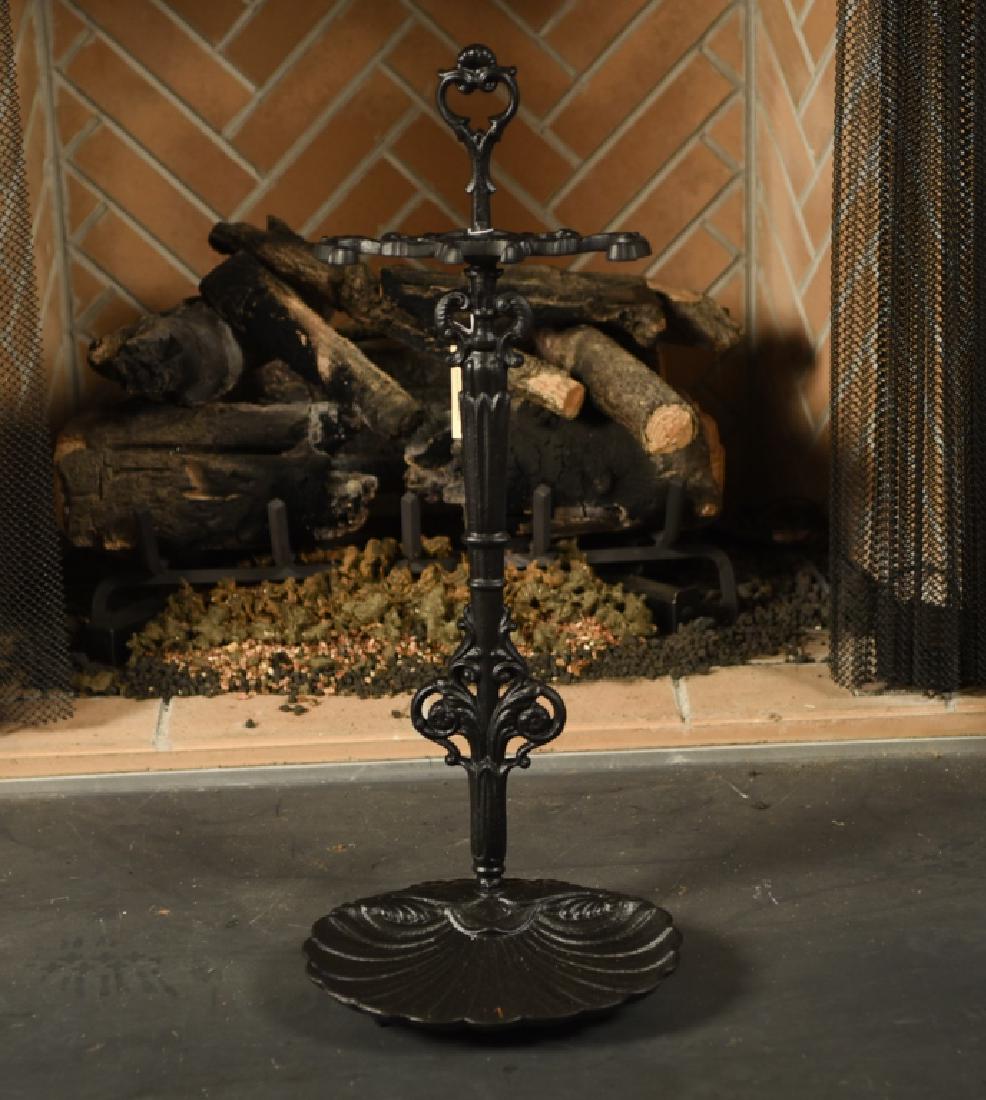 VICTORIAN CAST IRON FIREPLACE TOOL HOLDER: Ornate design with new black finish. Dimensions: H 26.5" x W 10" x D 10" Condition: Refinished.