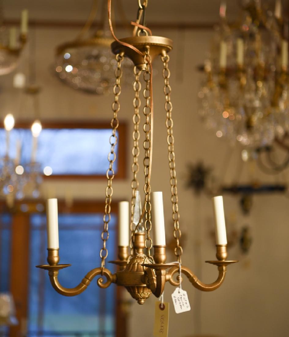 VINTAGE FOUR-LIGHT CHANDELIER: Faux antiqued surface with single crystal. Dimensions: H 19" x Dia. 17" Condition: No issues to note.