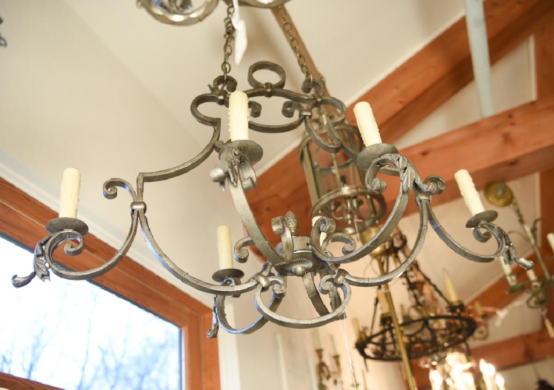 VINTAGE WROUGHT IRON CHANDELIER: 6-light. Antiqued silver finish. Dimensions: H 39" x W 36" x D 21" Condition: No issues to note.