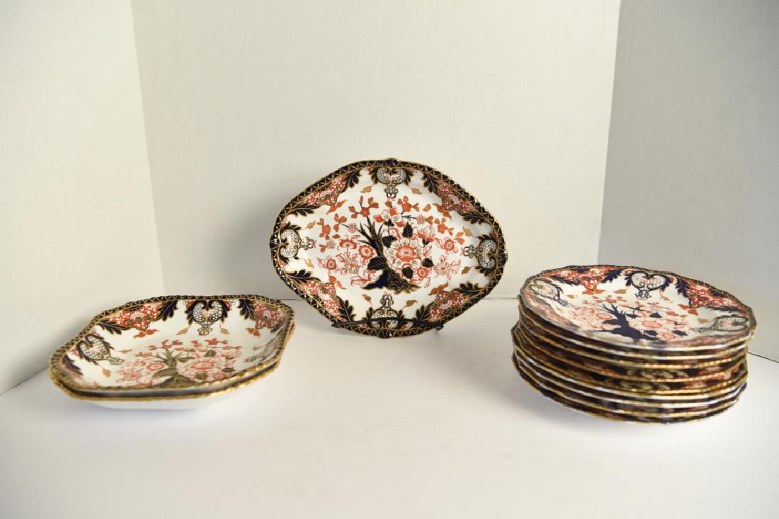 19TH C. ROYAL CROWN DERBY PARTIAL DINNER SERVICE: Late 19th century. Imari pattern. Mixed set. Consists of (9) 9" plates, plus three serving platters. Dimensions: (Plate) Dia. 9" Condition: Four plates with hairlines/cracks. Rubbing to rims. One chip