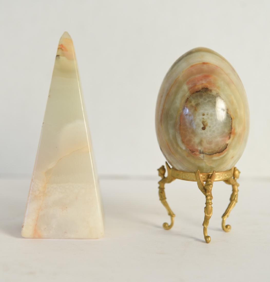 GROUPING OF ONYX MARBLE: Obelisk and decorative egg on stand. Dimensions: (Obelisk) H 6" x W 2.5" x D 2.5" Condition: Small flea bite to tip of obelisk.