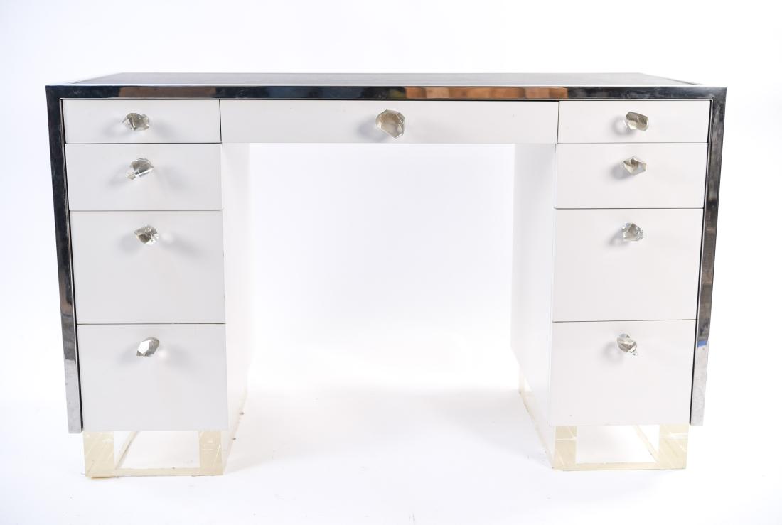 VANITY DESK, W/ CHROME ACCENTS & ROCK CRYSTAL PULL: Lucite base with chrome trim and draw pulls Dimensions: H 30" x W 48" x D 22" Condition: Light surface scratches.