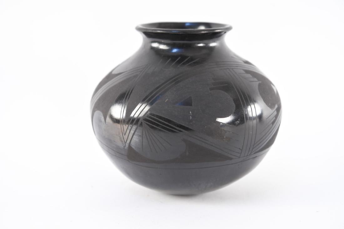MANUEL BANUELOS & MARIA ORTIZ JAR: Chihuahua black pottery jar in Neo-Casa Grandes style. Dimensions: H 8" x Dia. 9" Condition: Few dings to surface around waist of piece. Provenance: From a Greenwich, CT estate.
