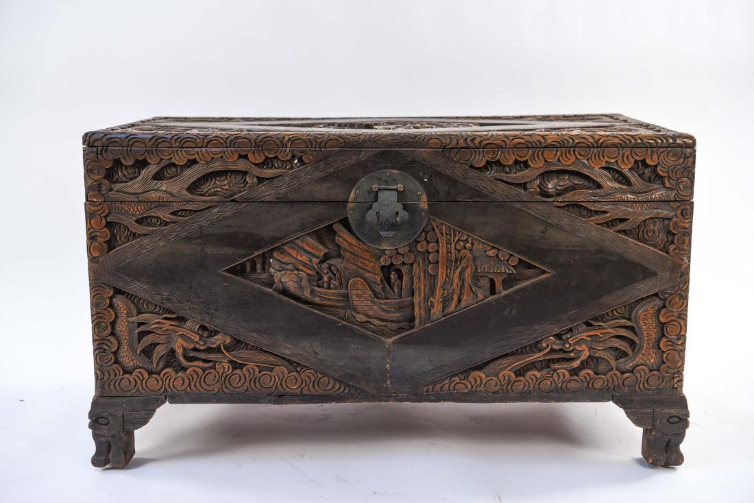 CARVED CAMPHOR WOOD CHEST: From the Anton Otto Fischer Estate (Illustrator of Moby Dick & 10,000 Leagues Under The Sea!) Dimensions: H 22" x W 38.5" x D 18.5" Condition: Some splits, finish wear, surface scratches. Oxidation to