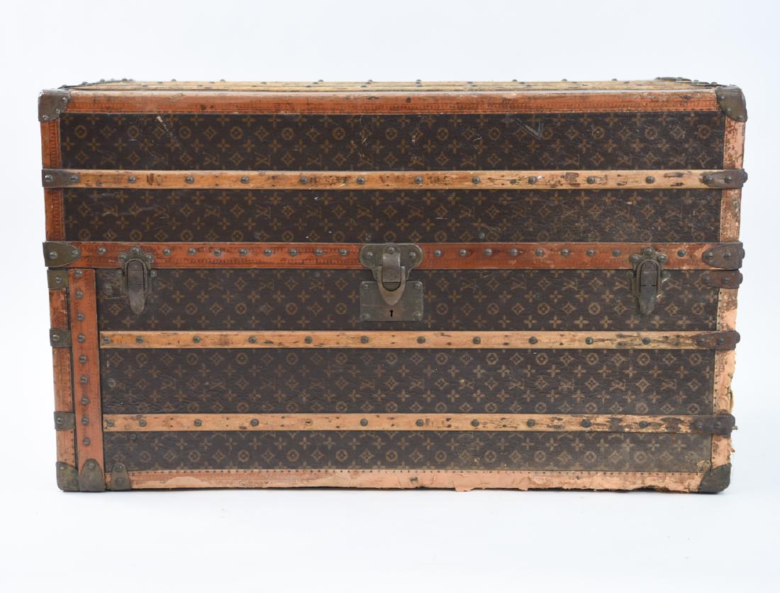 LOUIS VUITTON WARDROBE TRUNK: Marked on hardware and leather trim. Dimensions: H 44" x W 26" x D 22" Condition: Showing wear consistent with age and use. Some scuffs, scratches, and losses. Wear and discoloration of fabric to exte