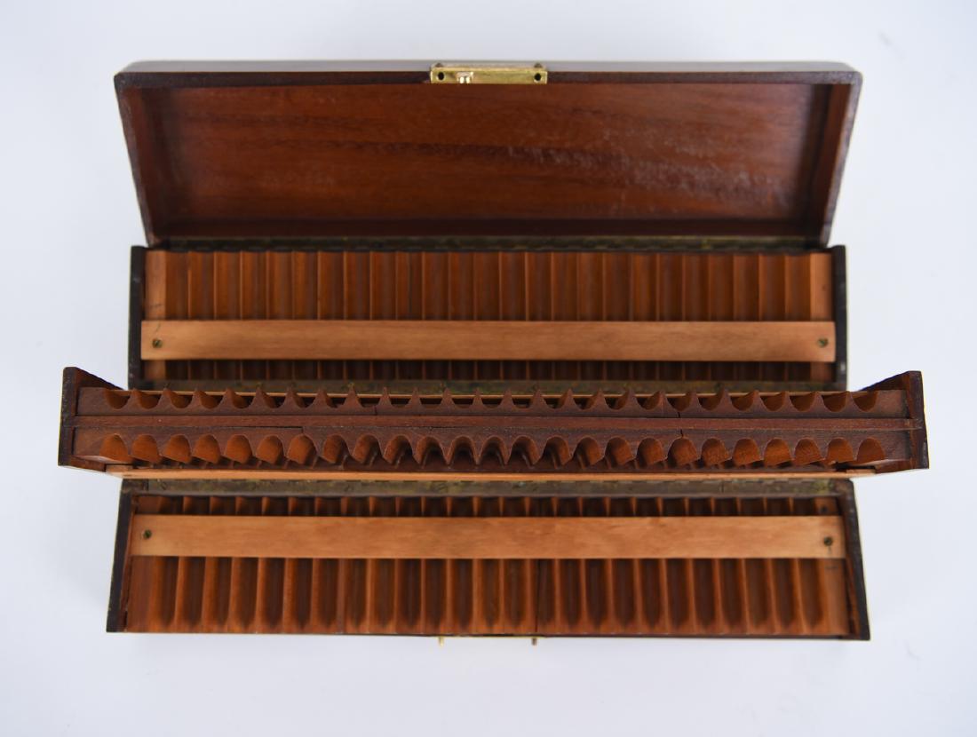 1920S DUNHILL CIGARETTE BOX: Marked Dunhill on interior of locking mechanism. Dimensions: H 3.5" x W 12.5" x D 3.25" Condition: Showing overall light wear. Some cracks to interior inserts.