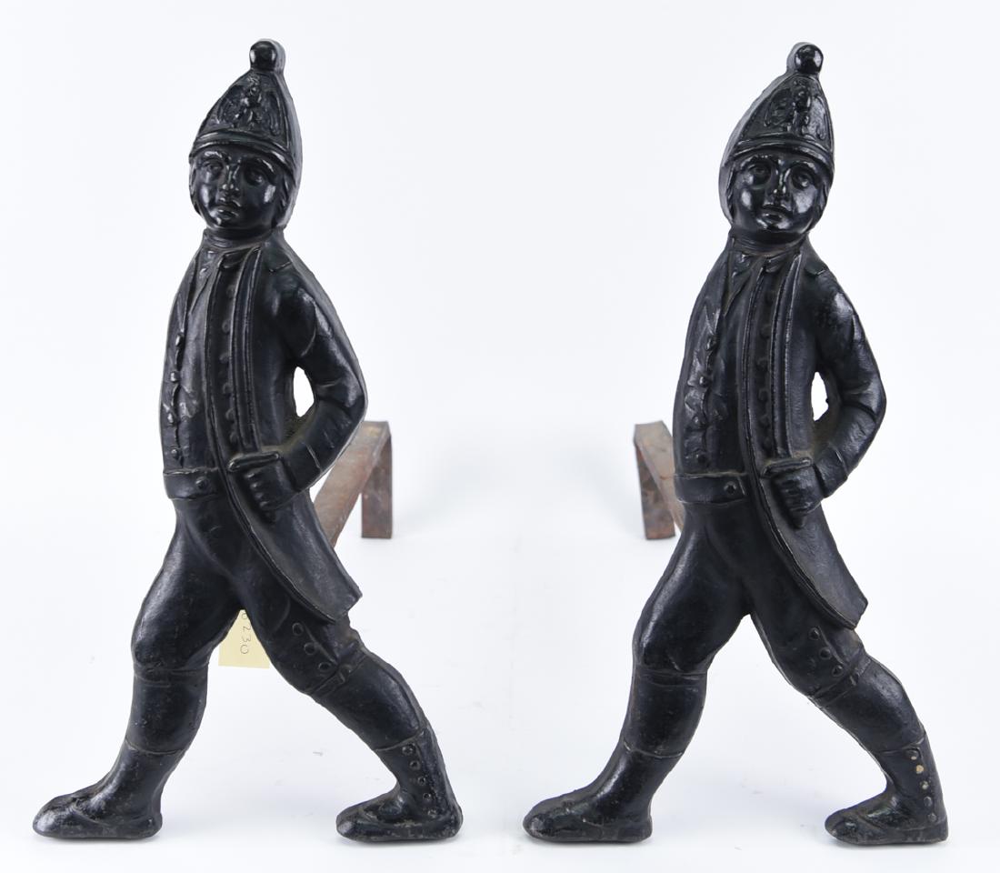 ANTIQUE CAST IRON HESSIAN ANDIRONS: Dimensions: H 19.75" x W 11" x D 23" Condition: Light wear consistent with age and use.