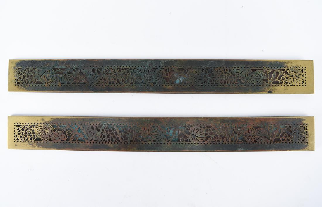 TIFFANY STUDIOS BRONZE GRAPEVINE BLOTTER ENDS: Marked: Tiffany Studios New York 999. Dimensions: L 19.25" x W 2.25" Condition: Showing finish wear and areas of tarnish and patina.