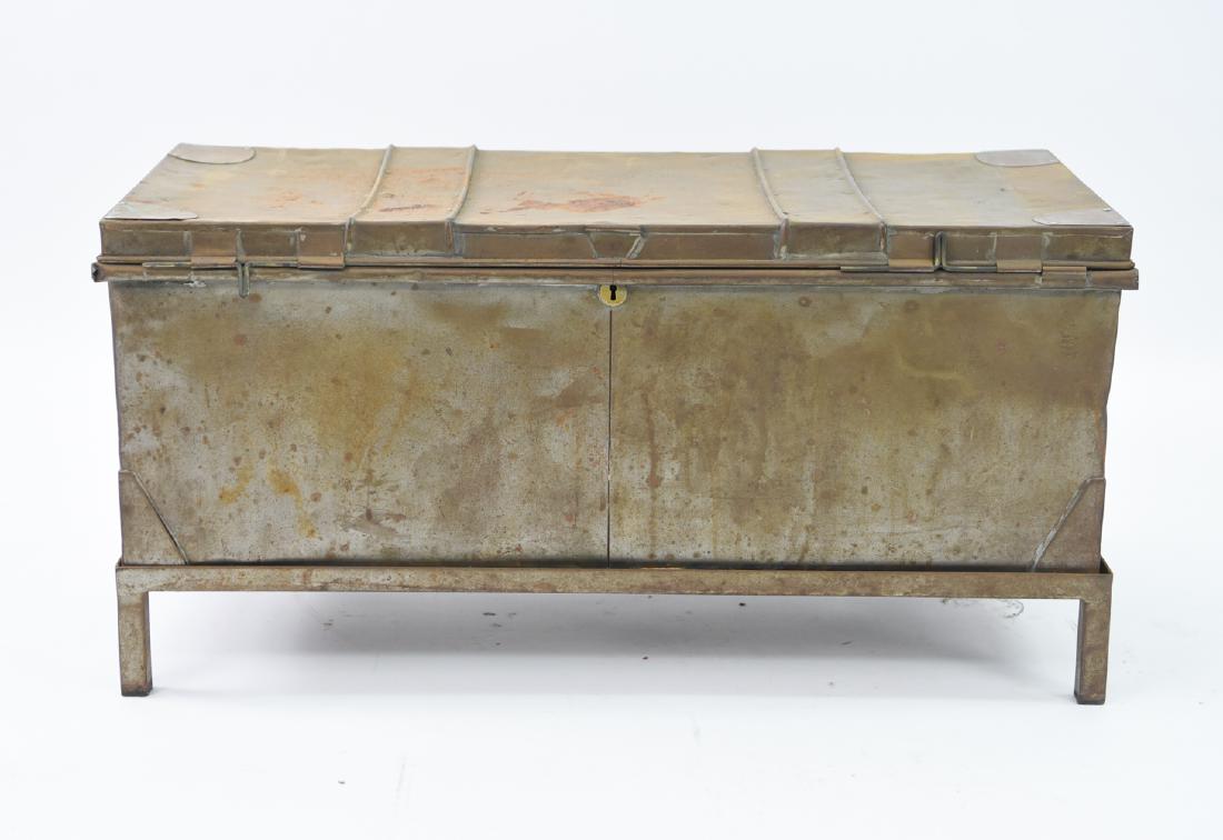 ANTIQUE TIN CHEST ON STAND: Chest is 19th century, base more recent. Dimensions: (On base) H 18" x W 36.5" x D 16" Condition: Rusted and distressed surface.