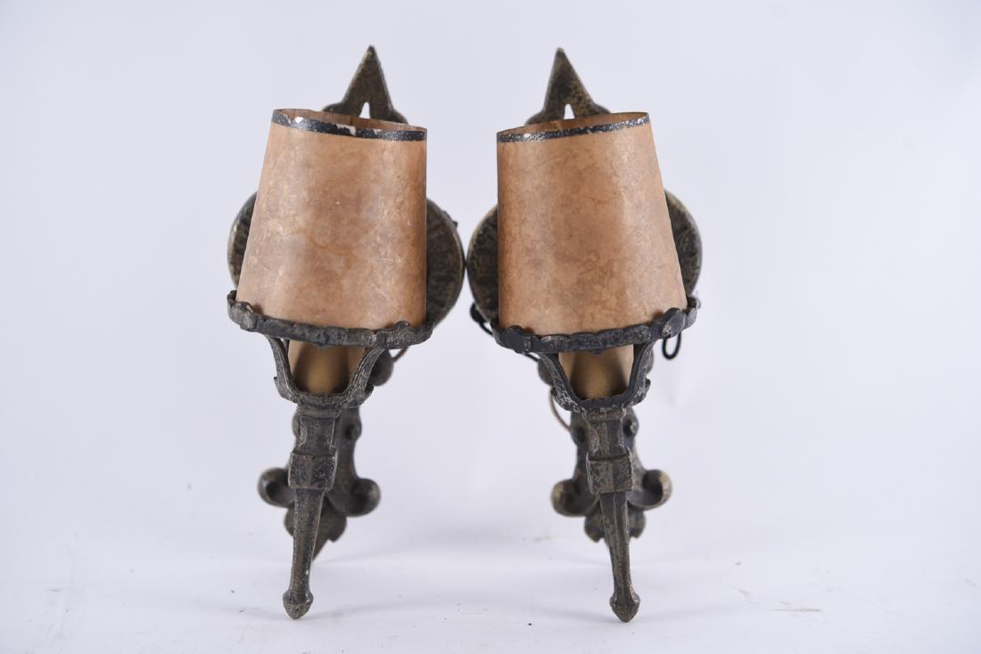 PAIR OF ARTS & CRAFTS IRON SCONCES: Spanish revival style with faux antique surface. Dimensions: H 10" x W 5" x D 5" Condition: Need rewiring. No shades.
