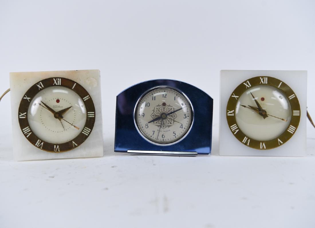 (3) ART DECO CLOCKS: Including Telechron, Seth Thomas. Dimensions: (Telechron) H 5.25" x W 5.25" x D 2" Condition: Not tested. Some chips to edges. Surface wear.
