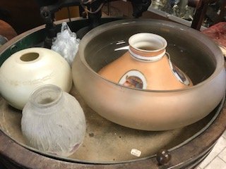 GROUPING OF GLASS LAMP LIGHTING SHADES: (7) pieces. Including 19th century glass shade with Egyptian portrait motif, art deco molded glass, etc. Dimensions: (Largest) H 6" x Dia. 13" Condition: Edges rough, one with breaks.