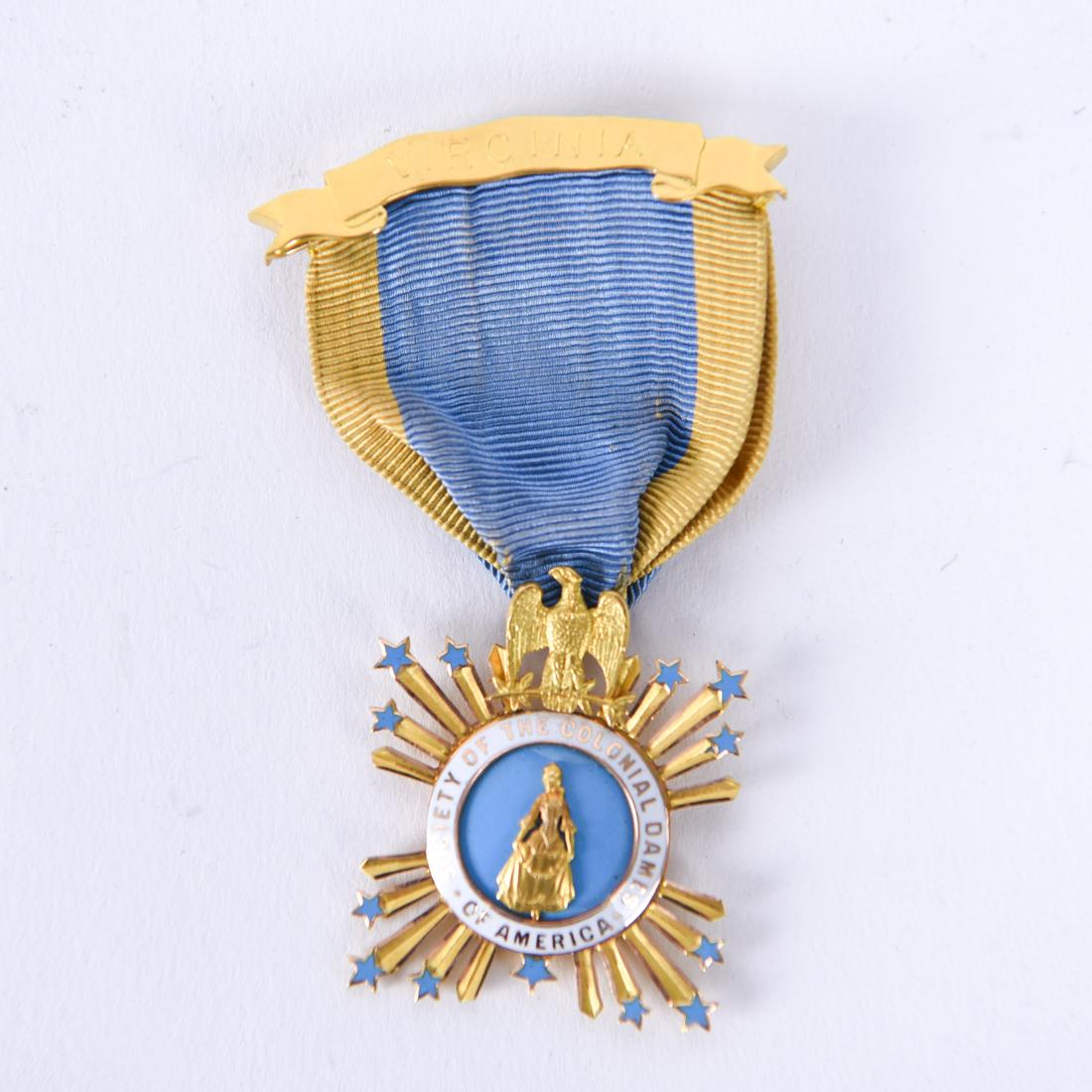 SOCIETY OF THE COLONIAL DAMES OF AMERICA MEDAL: Marked verso: Margaret Vowell Smith, No. 58, 1894. Dimensions: (Overall) H 2.75" x W 1.5" Condition: Slight discoloration to ribbon. Provenance: From the estate of descendants of George W. De Long, Lt