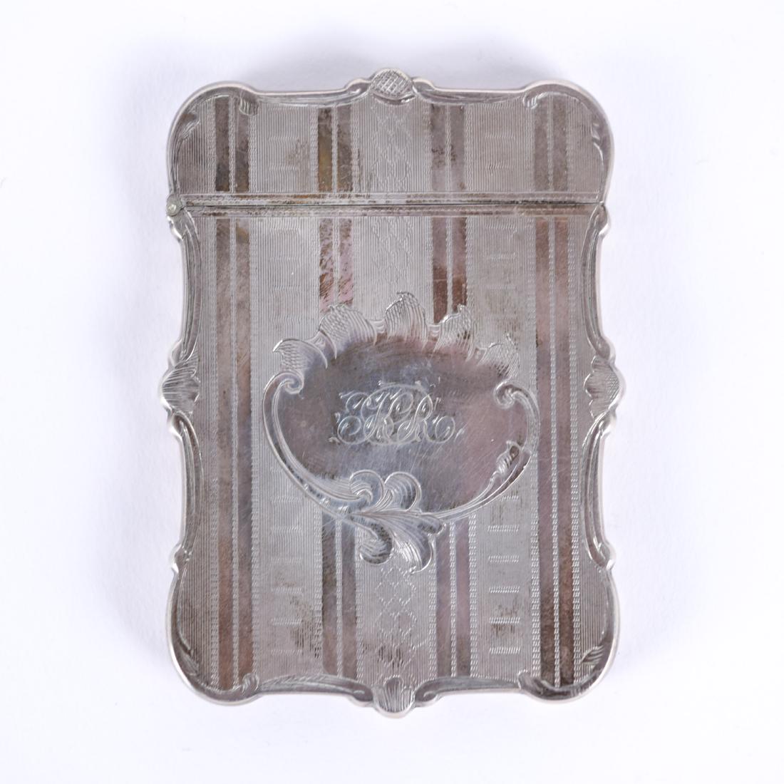 STERLING SILVER CARD CASE: Hallmarked to inner rim. Dimensions: H 3.5" x W 2.5" x D .25" Weight: 1.635 ozt. Condition: Light tarnish. Wear to leather case. Provenance: From the estate of descendants of George W. De Long, Lt. Co