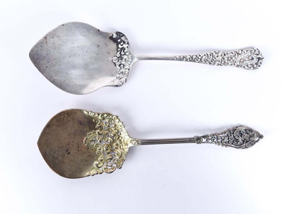 (2) STERLING SILVER SERVING UTENSILS: Marked sterling. Dimensions: (Longer) L 9.5" x W 3" Weight: (Total) 6.045 ozt. Condition: Some tarnish and surface wear. Provenance: From the estate of descendants of George W. De Long, Lt. Commander