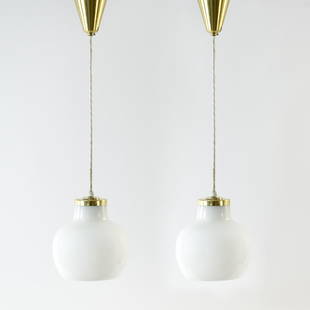 PAIR OF VILHELM LAURITZEN, LOUIS POULSEN PENDANTS: Opaline glass. Dimensions: H 8" x Dia. 7" Condition: Tarnish and surface scratches to brass. Wear consistent with age and use. D069