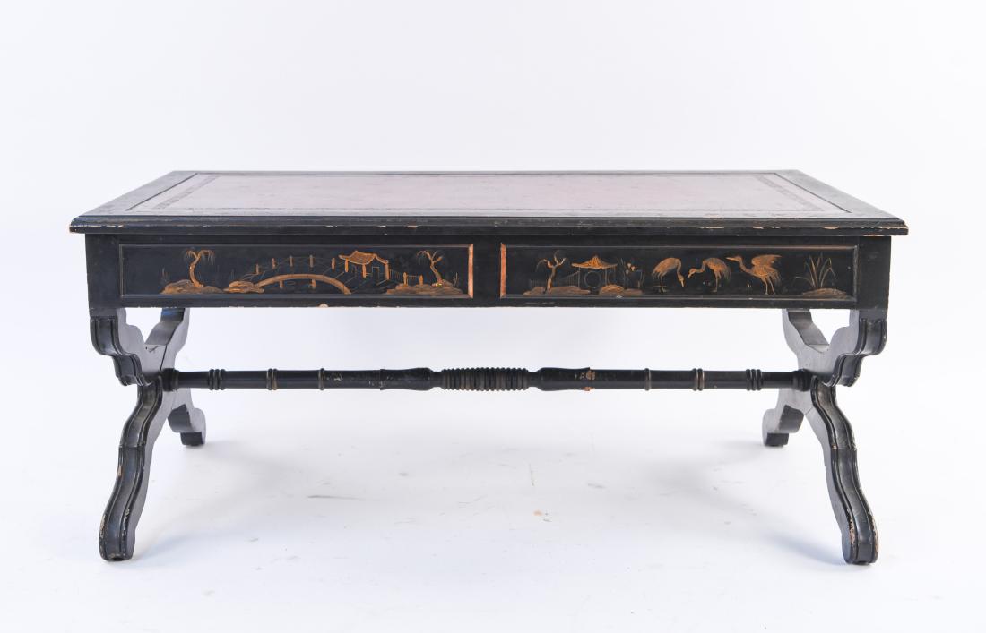 CHINOISERIE LEATHER TOP COFFEE TABLE: Dimensions: H 17.5" x W 39" x D 22.5" Condition: Paint loss, losses to trim. Gouges and scratches to leather. Wear throughout. Loss to wood on stretcher underneath.