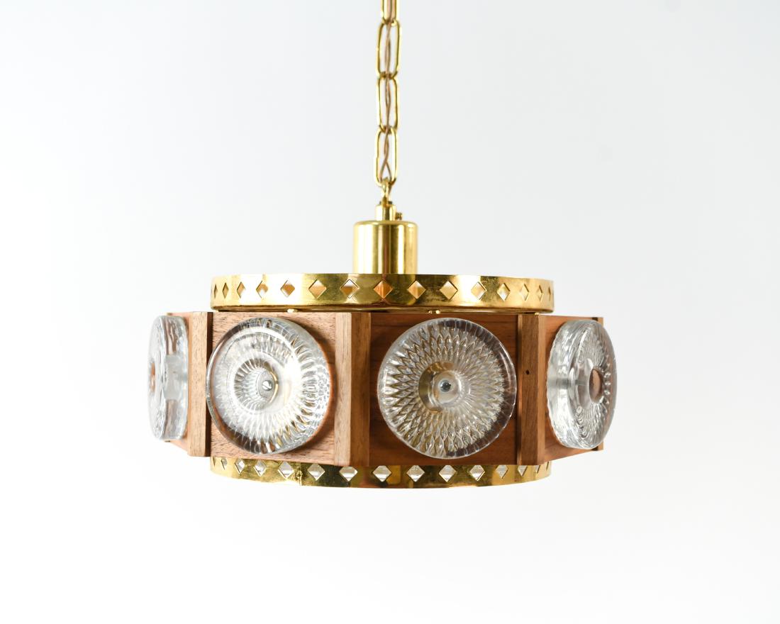 GLASS, BRASS, TEAK PENDANT CHANDELIER FOR ORREFORS: Carl Fagerlund for Orrefors. Dimensions: H 7.5" x Dia. 12.5" Condition: European wiring. Wear consistent with age and use. D011