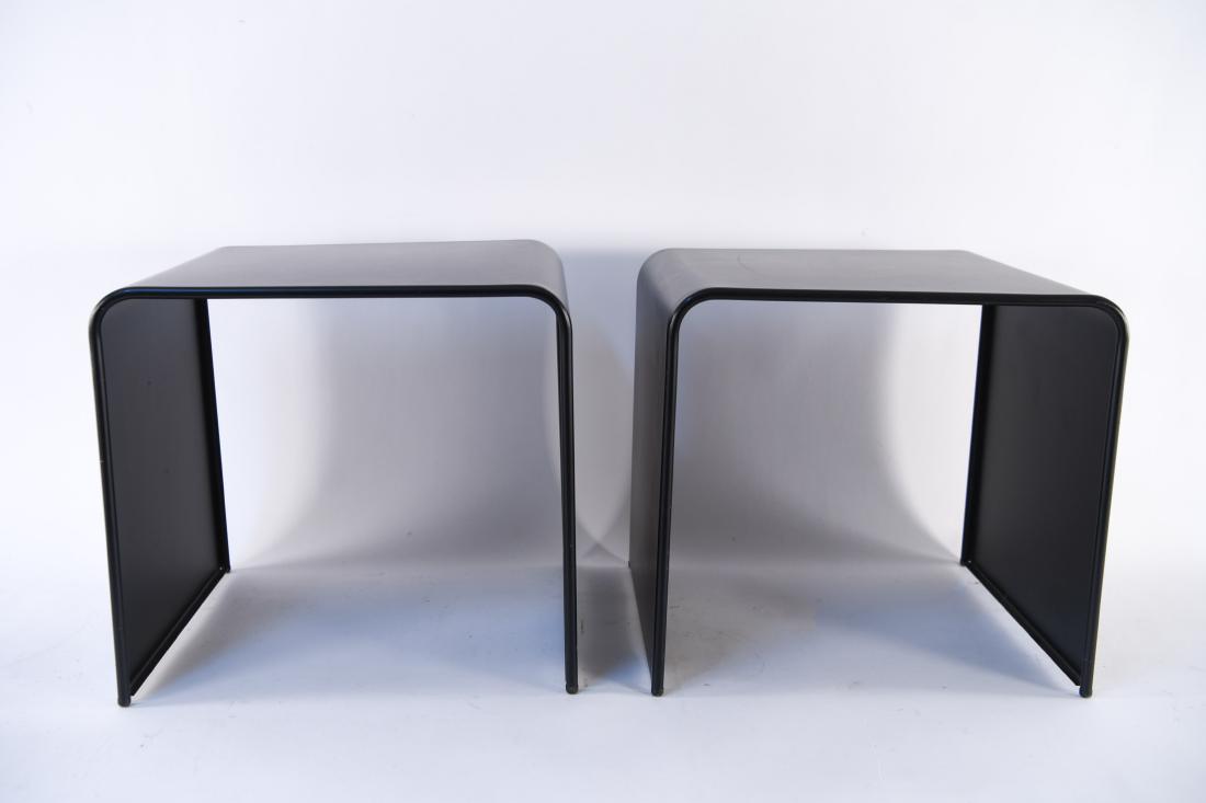 PAIR OF BLACK METAL C-FORM END TABLES: Dimensions: H 15" x W 16" x D 14.5" Condition: Showing a few scratches and scuffs.