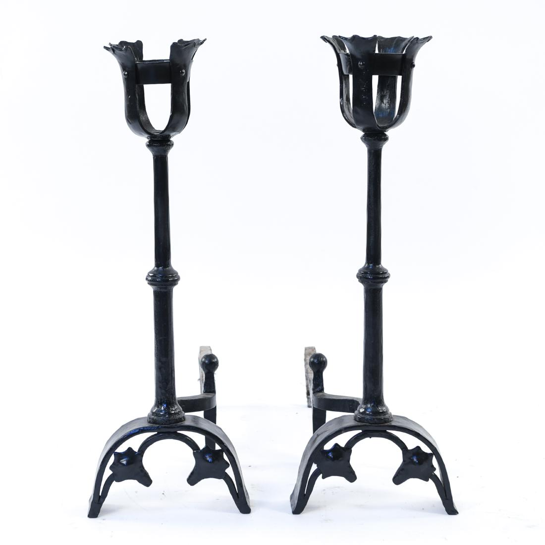 CAST IRON ANDIRONS / CANDLE HOLDERS: Dimensions: H 27" x W 9.25" x D 23" Condition: Wear consistent with use.