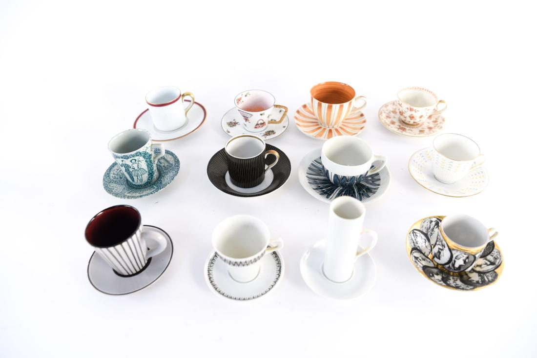 (12) MID-CENTURY CUPS & SAUCERS: Including Porsgrund Norway, Rorstrand Sweden, Fornasetti Italy, Delft, etc. Dimensions: (Largest saucer) Dia. 5.25" Condition: Varying, some with chips and wear.