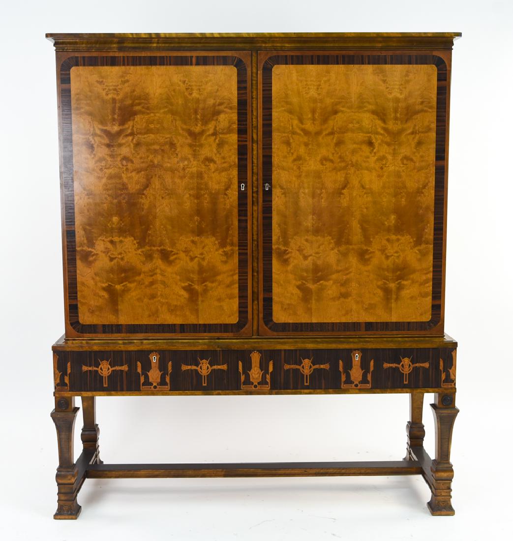 CARL MALMSTEN CABINET: Dimensions: H 66"x x W 55" x D 20.75" Condition: Key is present. Couple very small chips. Few small areas where inlay is just beginning to pull away. Showing very light overall wear consistent with ag
