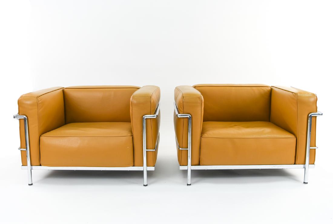 PAIR OF LE CORBUSIER LC3 STYLE LOUNGE CHAIRS: Dimensions: H 25.75" x W 37.75" x D 28.75" x SH 14.25" Condition: Light scuffs and marks to leather. Early indications of pitting to chrome.