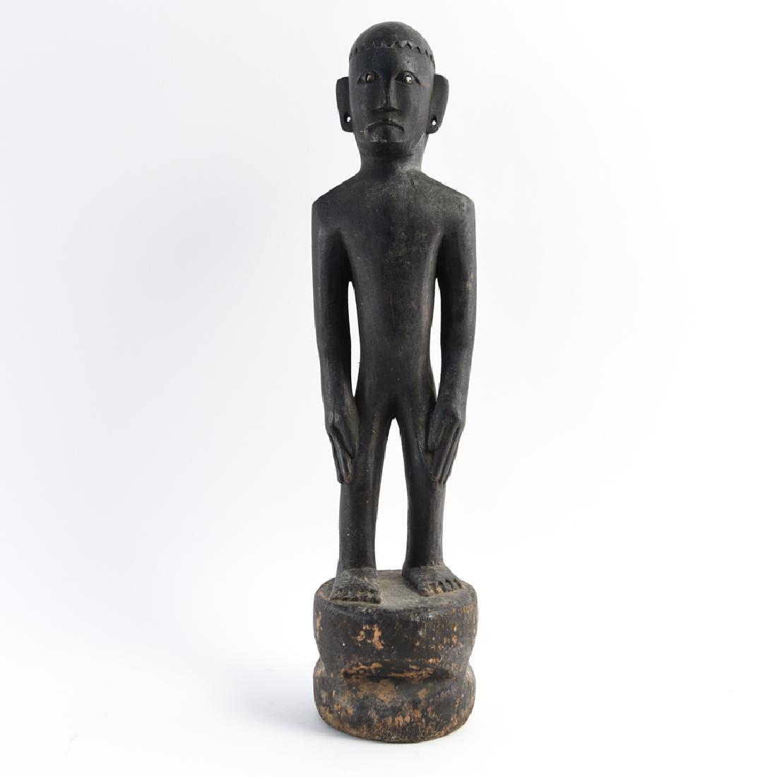 VINTAGE INDONESIAN CARVED FIGURE SCULPTURE: Dimensions: H 23.5" x Dia. 6" Condition: Some surface dirt including losses to finish.