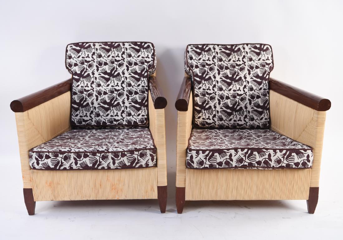 RARE JOHN HUTTON FOR DONGHIA WICKER LOUNGE CHAIRS: from the limited production Merbau Collection designed by John Hutton (1947-2006) for Donghia, circa 1995 Marked underneath. Dimensions: H 29.5" x W 28.75" x D 35" x SH 14.25" Condition: Rubbing and f