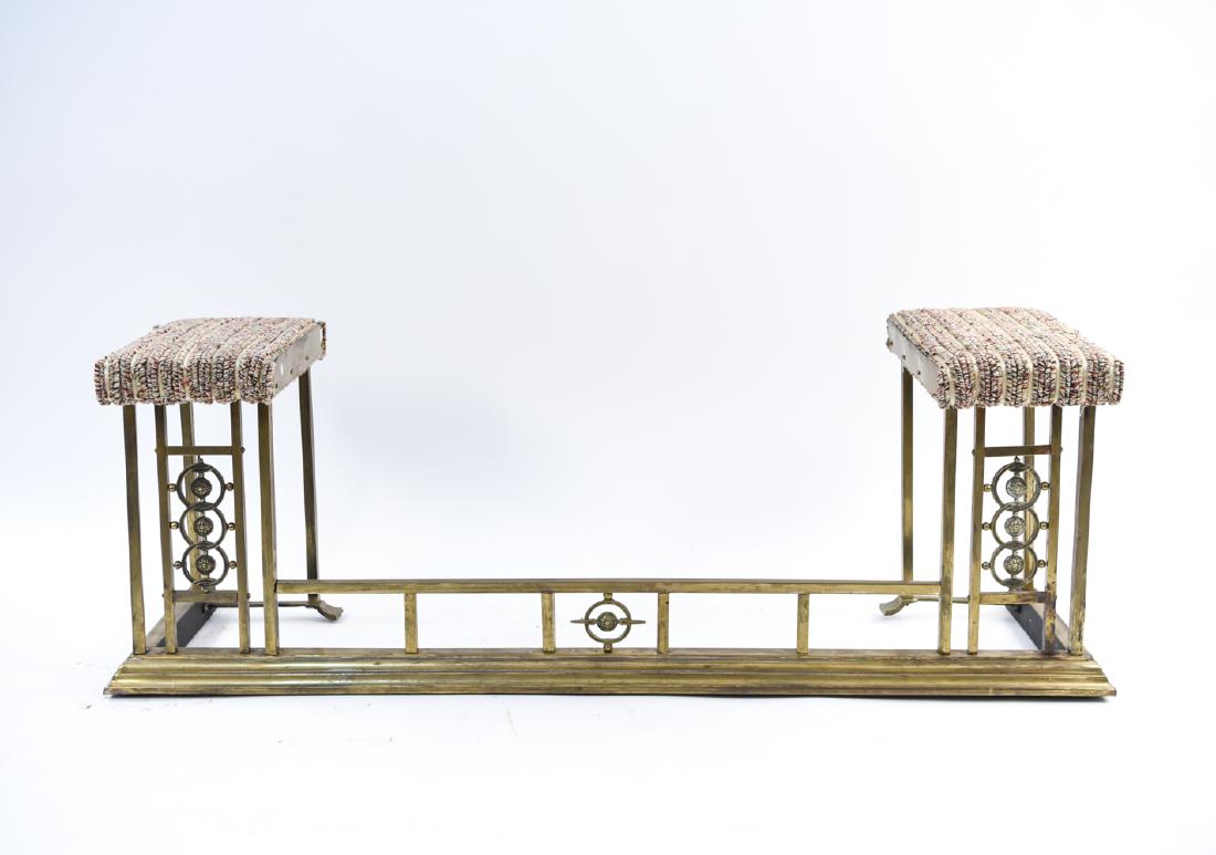 ANTIQUE BRASS FIRE FENDER BENCH: Vintage, brass. With upholstered seats. Dimensions: H 18" x W 54" x D 14.25" Condition: Repaired. Wear to corners. Surface distress.