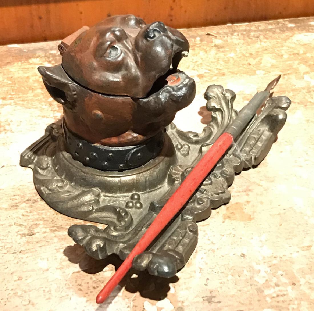 C. 1900 DOG INKWELL PEN HOLDER: Figural bulldog or bulldog form. Dimensions: H 3.5" x W 8" x D 5" Condition: Showing light wear consistent with age and use.