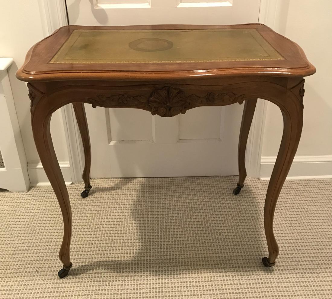 ANTIQUE FRENCH CARVED LEATHER TOP ONE DRAWER TABLE: Dimensions: H 29" x W 31.5" x D 19.25" Condition: Stress cracks to surface. Watermarks, scratches, and general wear to leather. Repair to one leg.