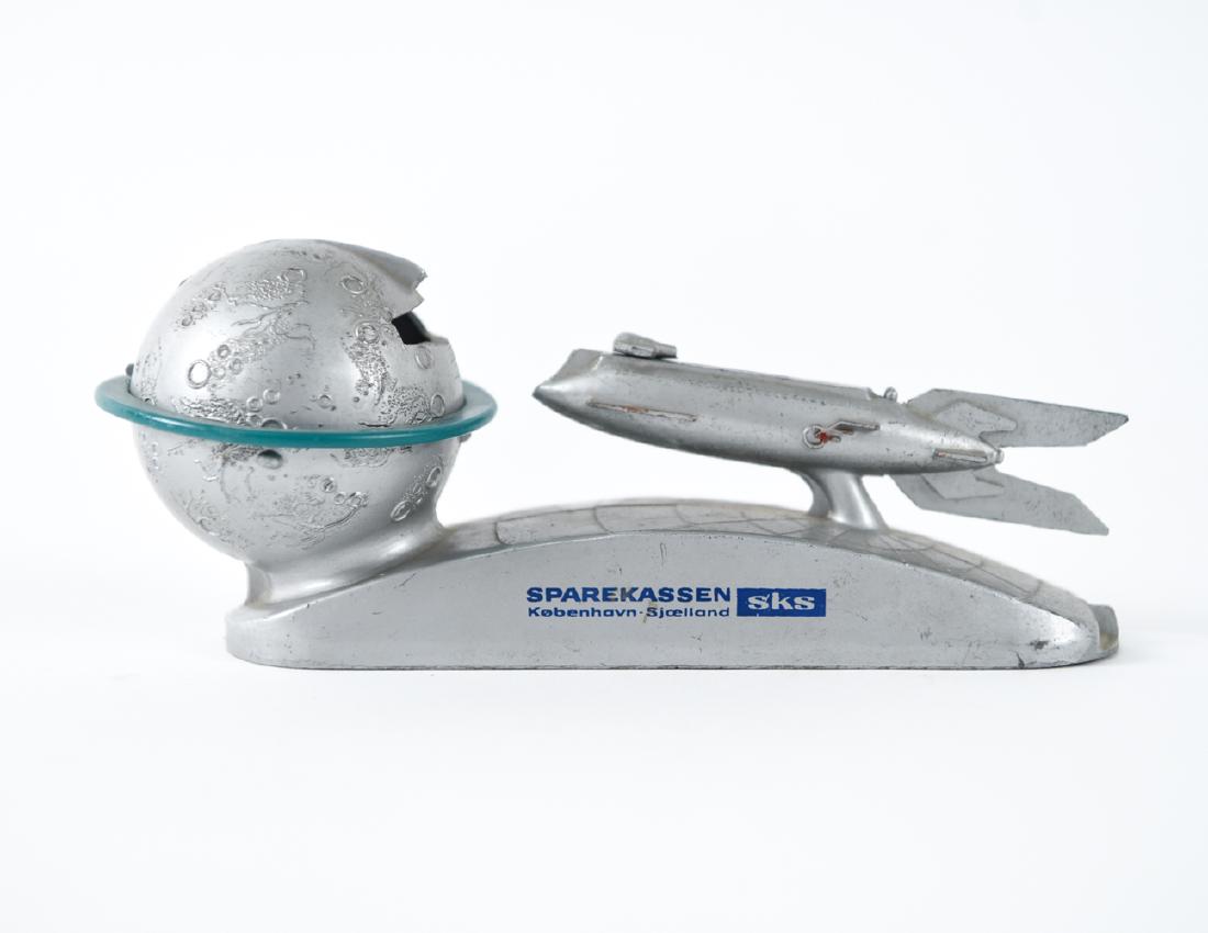 VINTAGE STRATO XU-232 MOON ROCKET TOY BANK: Dimensions: H 3.5" x W 8.5" x D 3.25" Condition: Missing underside plate. Surface wear throughout.