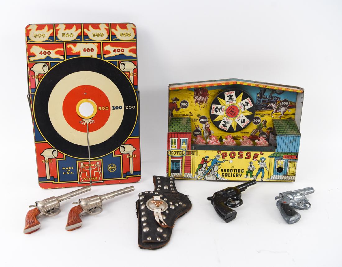 GROUPING OF VINTAGE TOY SHOOTING GAMES GUNS: Including (4) toy metal cap guns, one holster, "Posse" shooting gallery, and "Bust-Em" target game. Dimensions: (Bust-Em Box) H 17" x W 11" x D 1" Condition: Game in box, box with tears. Game looks to