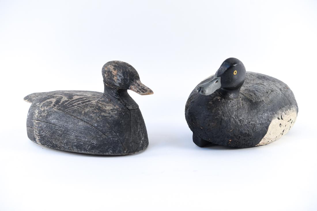 (2) ANTIQUE DUCK DECOYS: One signed G.B. underneath. Dimensions: (Painted) H 7.25" x W 8.25" x D 16.25" Condition: Showing wear consistent with age and use including paint loss, splits, few losses to wood.