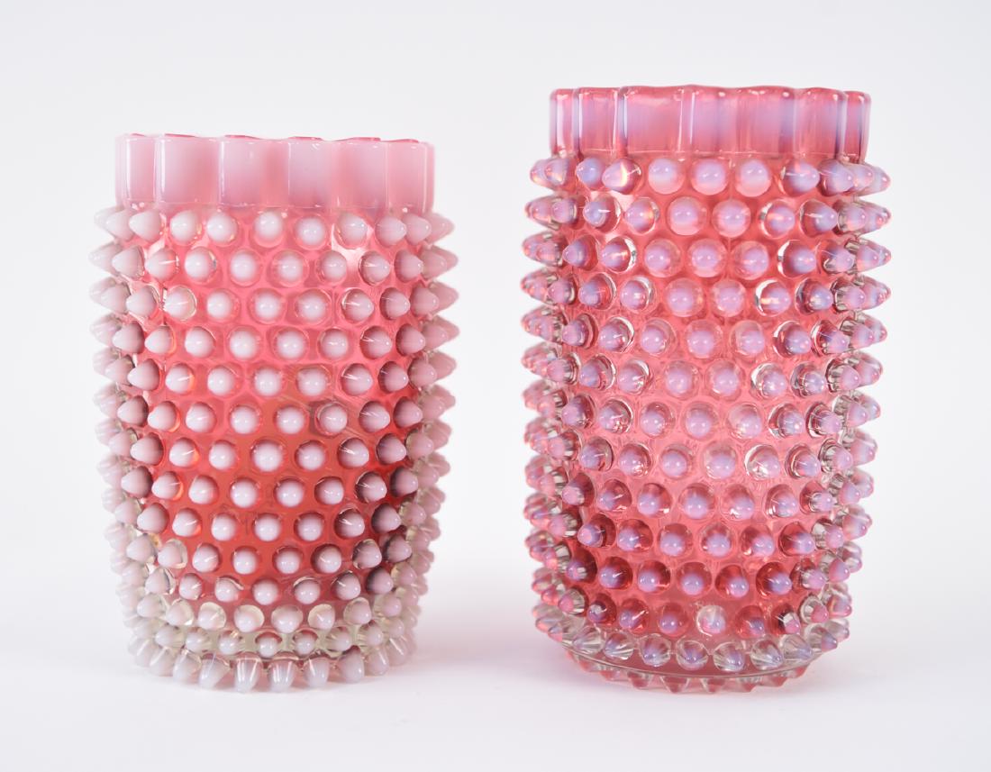 (2) PINK HOBNAIL GLASS VASES: Dimensions: (Taller) H 6.75" x Dia. 4" Condition: Few small chips, fractures. Not an identical pair.