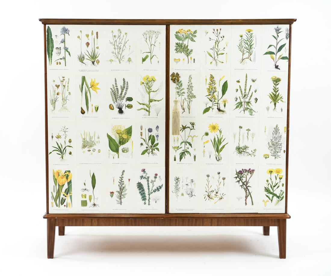 MID-CENTURY BOTANICAL PRINT CABINET: After Joseph Hoffman. Includes key. Dimensions: H 45" x W 47" x W 18.5" Condition: Showing overall light wear consistent with age and use including surface scratches, few nicks to edges. Areas of ligh