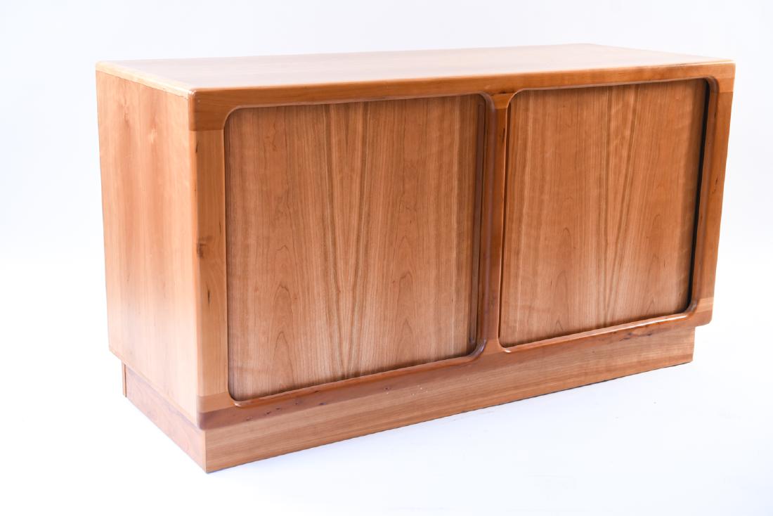SCANDINAVIAN TAMBOUR DOOR CABINET: Dimensions: H 30" x W 53.5" x D 20.5" Condition: Minor marks and scuffs to surface and base.