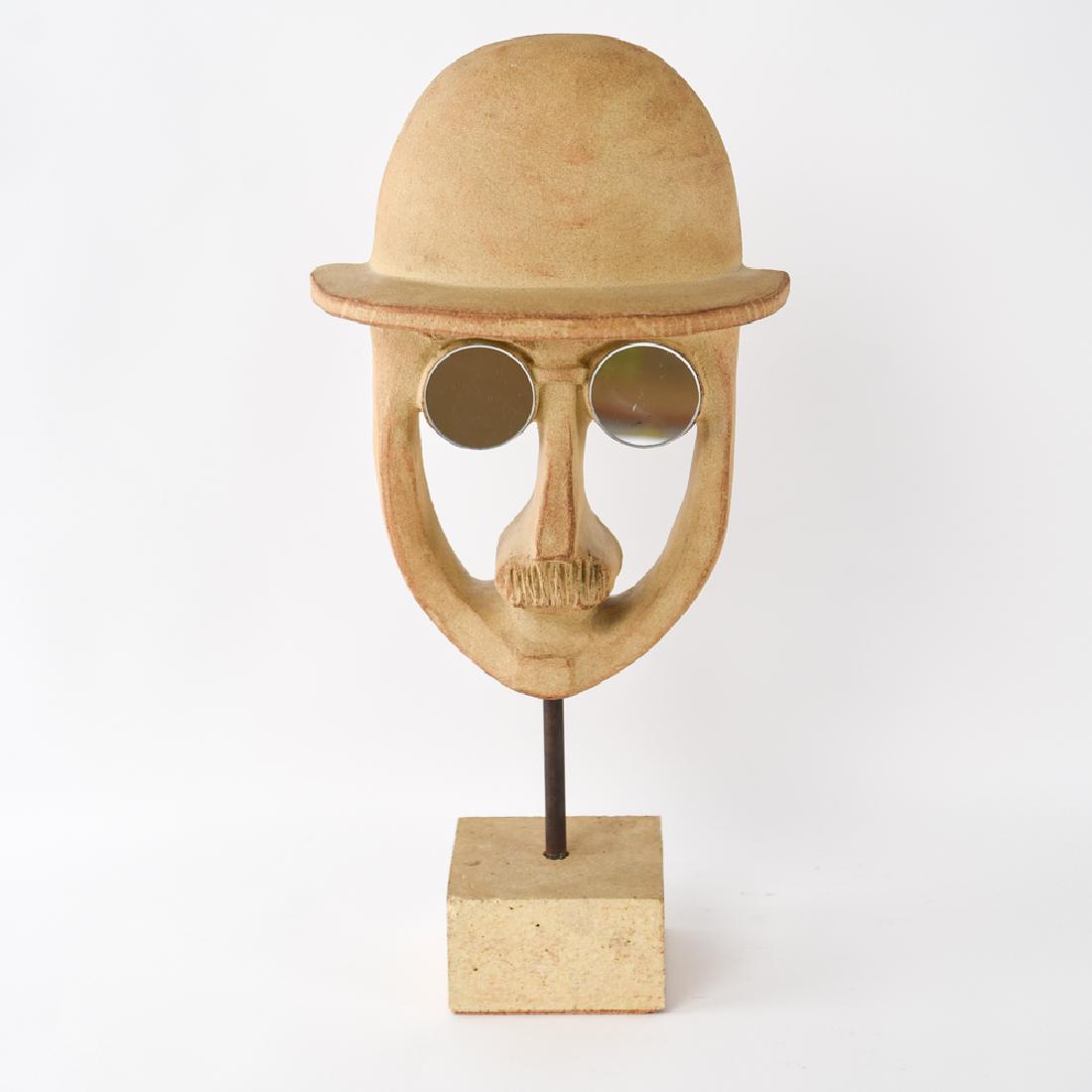 ERIC GIL BENNINGTON POTTERY MID-CENTURY SCULPTURE: Marked on verso: Bennington Potters, Bennington, Vermont. C 1965. Designed by Eric Gil. Dimensions: H 19.75" x W 10" x D 4.5" Condition: Couple marks to mirrored eye lenses. Couple chips to one corner