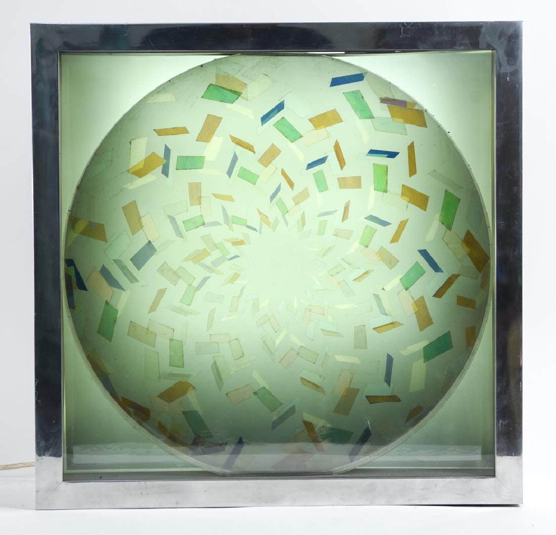 OLIVER BEVAN, BRITISH (B. 1941) ILLUMINATED: Illuminated kaleidoscope wall sculpture. Inscribed top left verso: Oliver Bevan 75. Dimensions: H 22.25" x W 22.5" x D 6" Condition: Not tested.